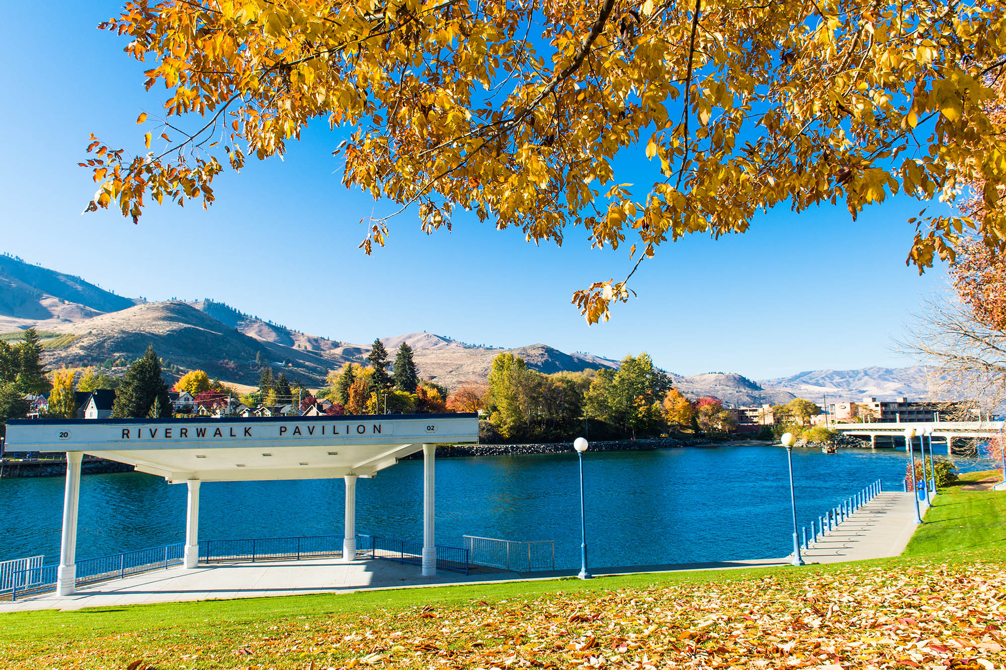 Fall foliage surrounds Chelan Riverwalk Park in Chelan, Washington; Credit: Lake Chelan Chamber of Commerce
