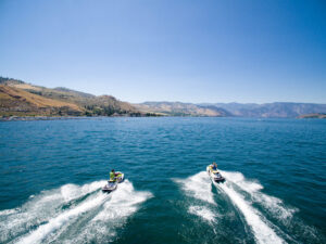 Riding Jet Skis on Lake Chelan in Chelan, Washington; Credit: Lake Chelan Chamber of Commerce