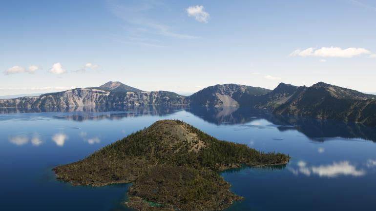 Aerial view of a lake with mountainous backdrop