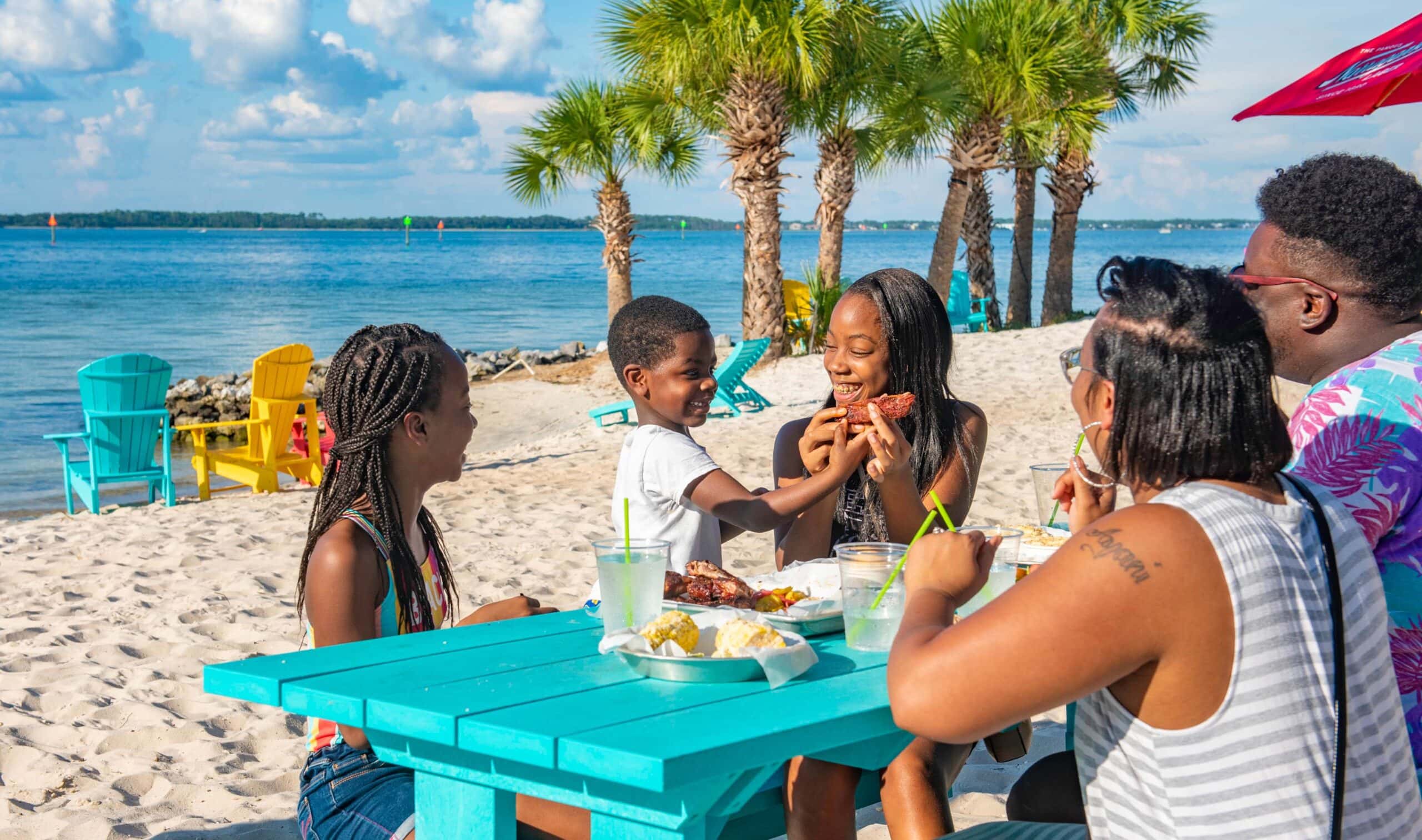 A family dining at Laguna’s Beach Bar + Grill in Pensacola, Florida