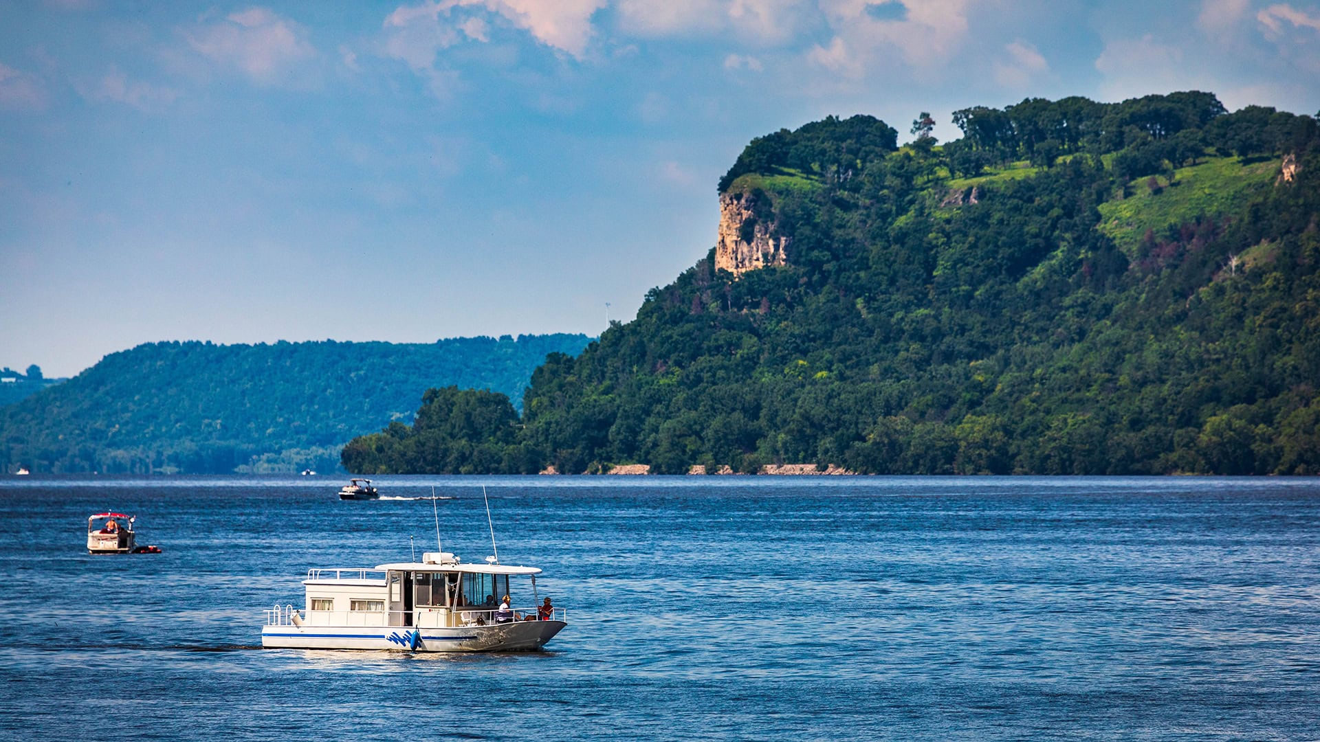 A houseboat glides across Lake Pepin near Lake City, Minnesota