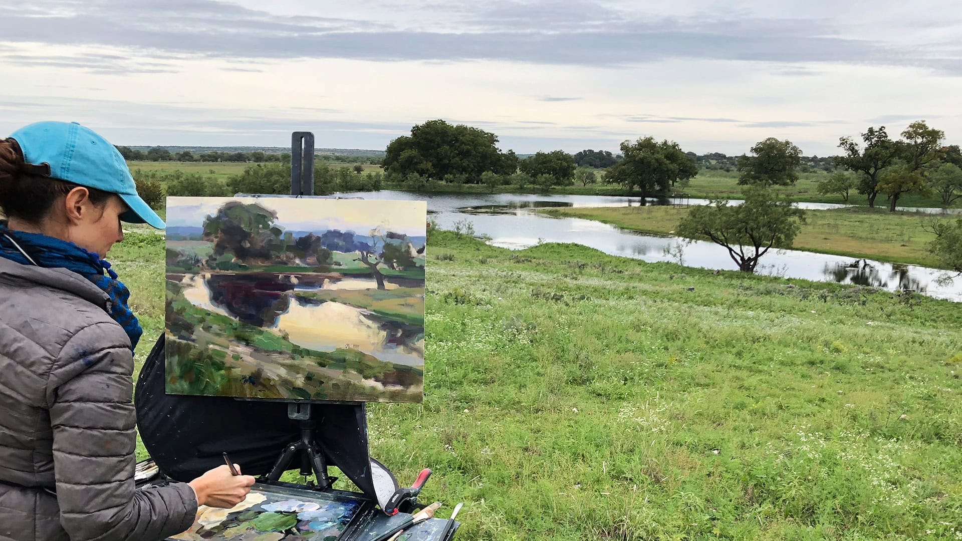 An artist working on a landscape painting during EnPleinAirTEXAS in San Angelo, Texas